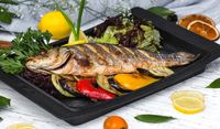 roasted-fish-garnished-with-lemon-slices-served-with-vegetables